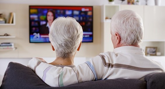 Senior Couple Watching TV Stock Photo